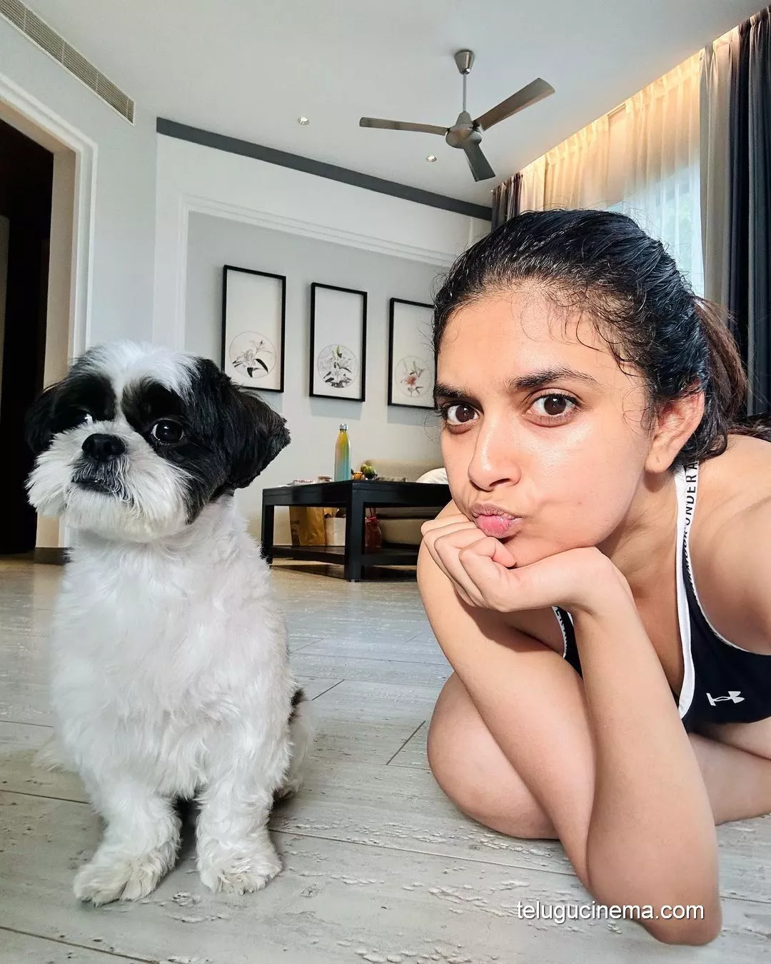 Keerthy Suresh playing with her pet dog